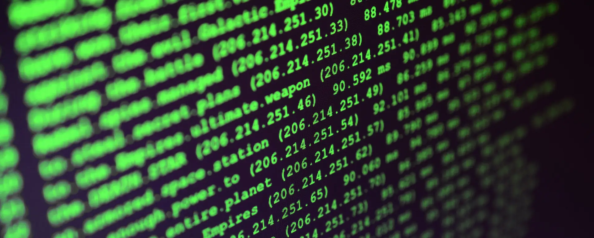 Macro shot of the command line on the monitor of the office computer. The concept of the programmer's work. Information line flow